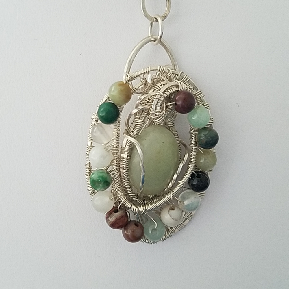Wire Weaved Sterling Silver Pendant with pale jade